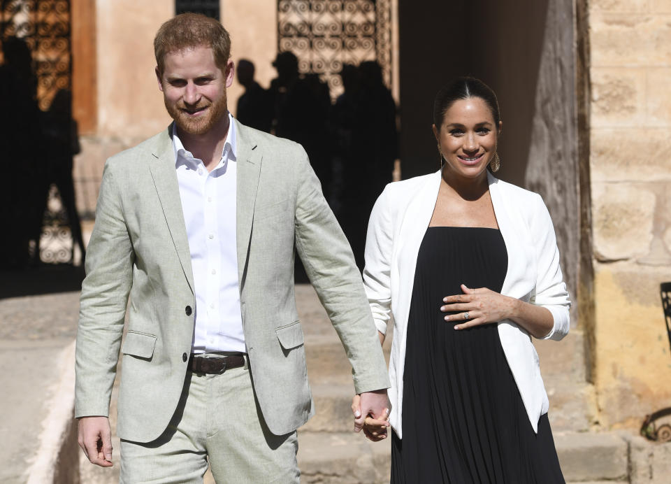 FILE - In this Monday, Feb. 25, 2019 file photo, Britain's Prince Harry and Meghan, Duchess of Sussex visit the Andalusian Gardens in Rabat, Morocco, Monday, Feb. 25, 2019. The time is drawing near for the impending royal birth of the first child for Prince Harry and his wife Meghan, the Duchess of Sussex. The couple is keeping many details about Meghan’s pregnancy and birth plan private and say they don’t know the baby’s gender yet. (Facundo Arrizabalaga/Pool Photo via AP, File)