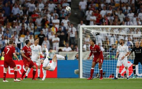 Bale connects and the ball heads goalwards - Credit: REUTERS