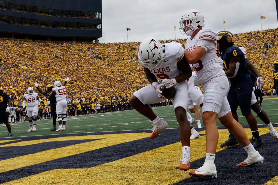 Texas running back Jerrick Gibson celebrates after scoring in the first half Saturday against the Michigan Wolverines at Michigan Stadium. The Longhorns rolled to a 31-12 win.