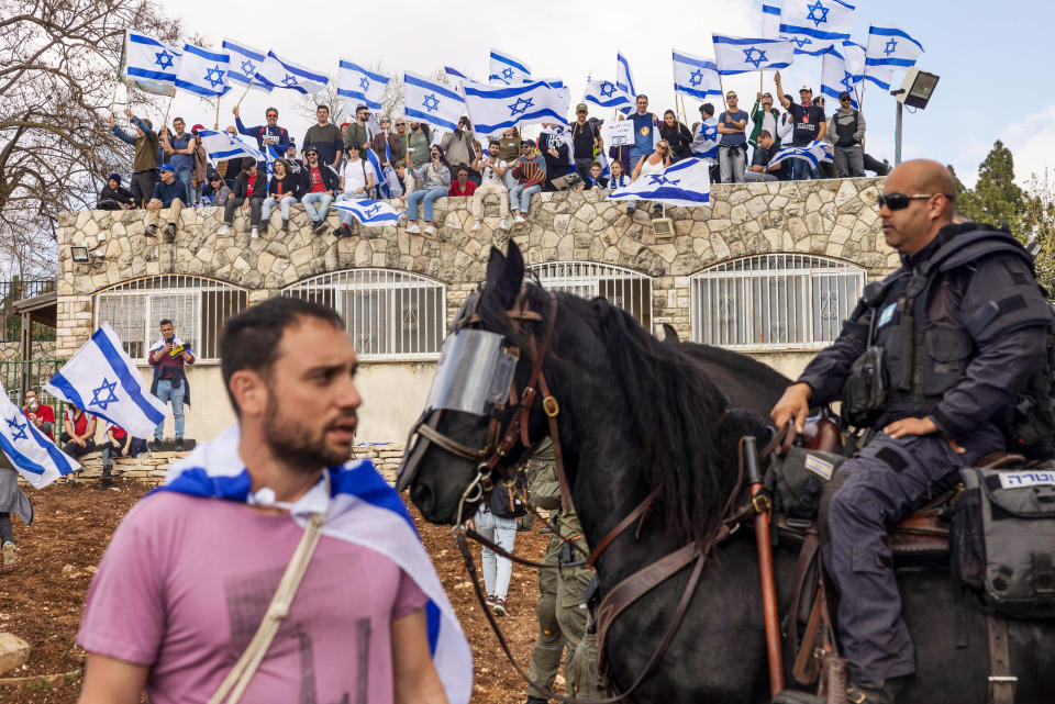 Netanyahu is considering a delay to his judicial overhaul after protests escalated, while the countrys main trade union joined a national strike which halted international flights.  (Kobi Wolf / Bloomberg via Getty Images)