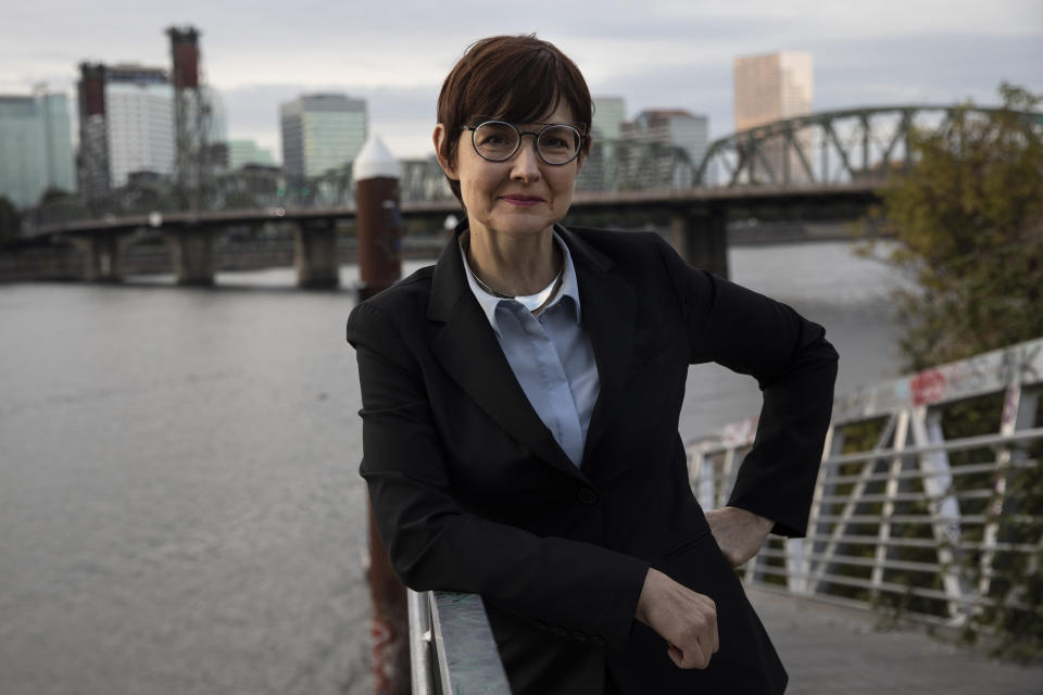 FILE - In this Oct. 9, 2020, file photo, mayoral candidate Sarah Iannarone poses by the Willamette River in Portland, Ore. Iannarone is facing Mayor Ted Wheeler in the election on Tuesday, Nov. 3, 2020. (AP Photo/Paula Bronstein, File)