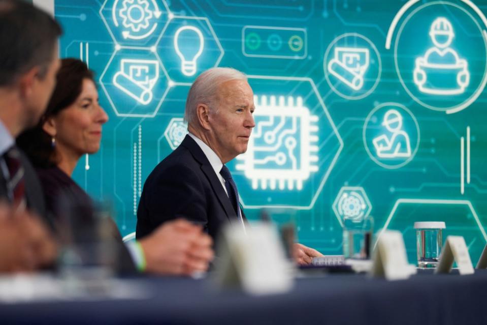 President Biden and Commerce Secretary Gina Raimondo discussing the CHIPS Act in 2022. REUTERS