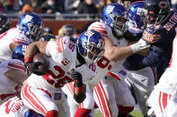 New York Giants running back Saquon Barkley caries the ball during the first half of an NFL football game against the Chicago Bears Sunday, Jan. 2, 2022, in Chicago. (AP Photo/David Banks)