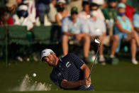 Marc Leishman, of Australia, hits from a bunker on the 18th hole during the final round of the Masters golf tournament on Sunday, April 11, 2021, in Augusta, Ga. (AP Photo/Matt Slocum)