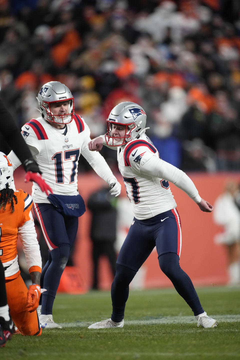 New England Patriots place-kicker Chad Ryland (37) reacts after kicking the game winning field goal with seconds left during the second half of an NFL football game against the Denver Broncos, Sunday, Dec. 24, 2023, in Denver. (AP Photo/David Zalubowski)