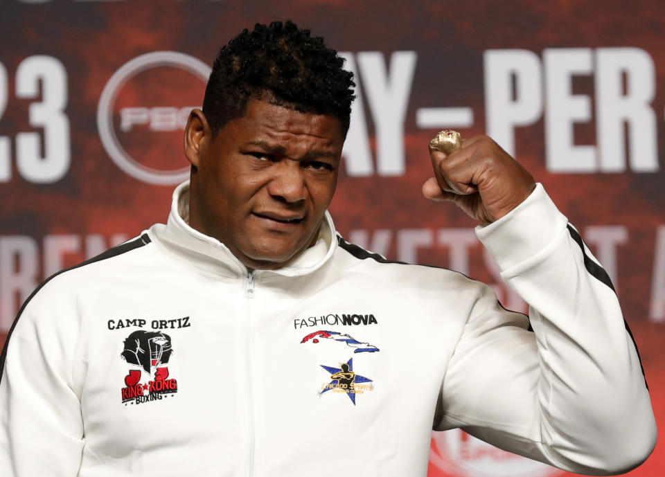 Heavyweight boxer Luis Ortiz arrives for a news conference at MGM Grand Garden Arena Las Vegas Wednesday, Nov. 20, 2019. Otiz will challenge WBC heavyweight champion Deontay Wilder in a rematch at the arena on Saturday, Nov. 23, 2019. (Steve Marcus/Las Vegas Sun via AP)
