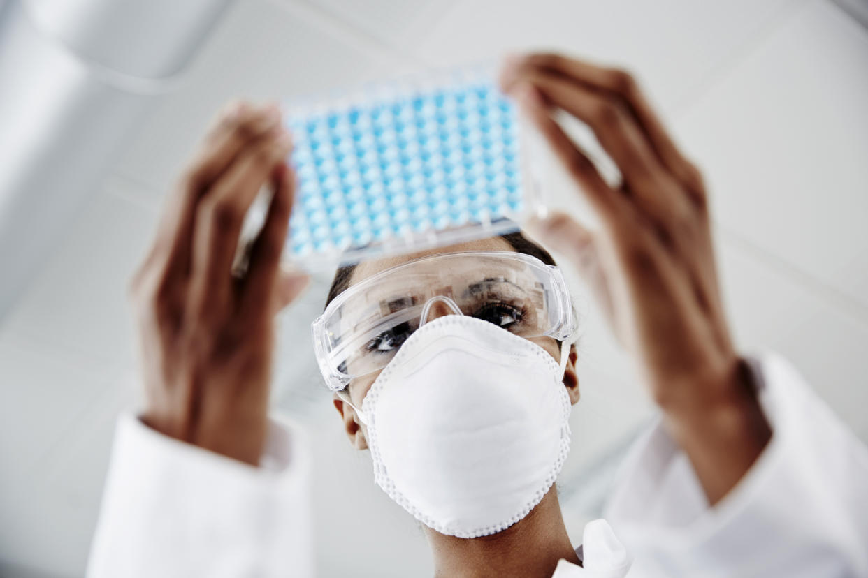 Woman examining laboratory samples