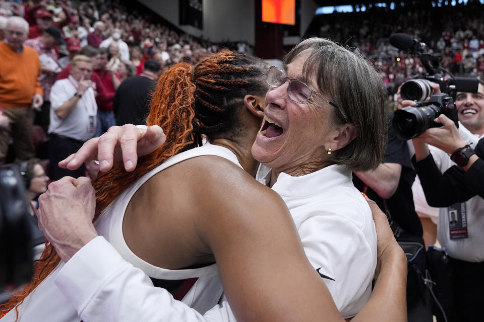 Stanford head coach Tara VanDerveer, right, is congratulated by forward Kiki Iriafen after the team's victory over Oregon State in an NCAA college basketball game, Sunday, Jan. 21, 2024, in Stanford, Calif. VanDerveer broke the college basketball record for wins with the victory. (AP Photo/Godofredo A. Vásquez)