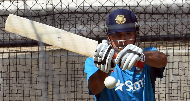 India's captain Mahendra Singh Dhoni bats in the nets during a training session in Adelaide, on February 14, 2015