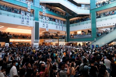 Anti-government protesters hold a rally in a shopping mall in Sha Tin, Hong Kong, China