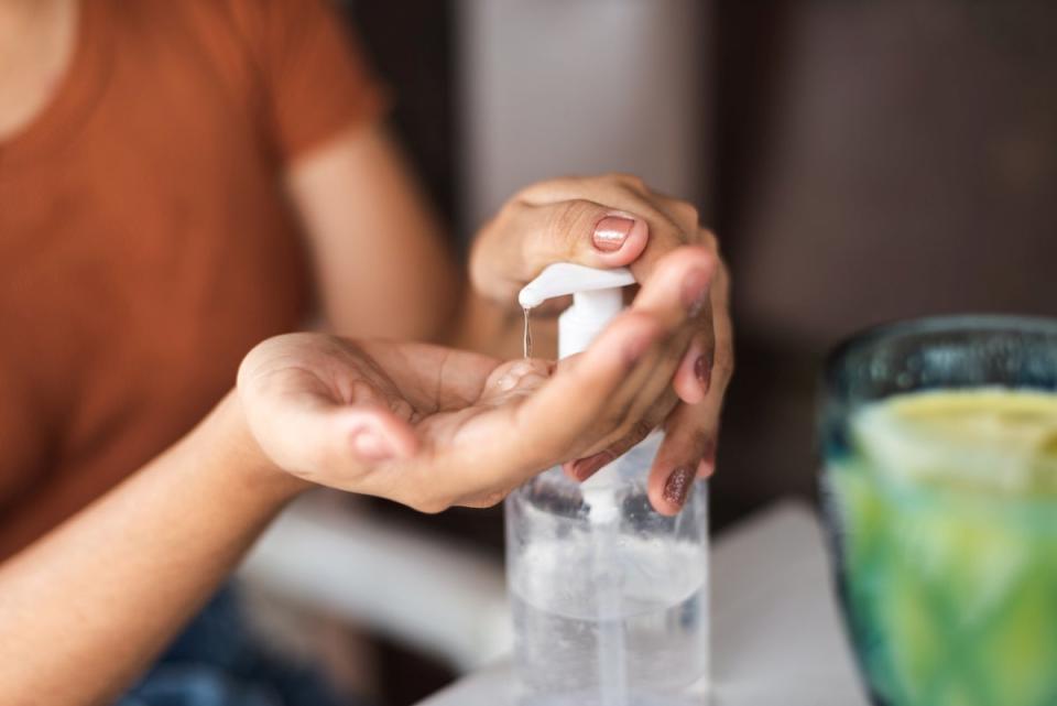 Person using hand sanitizer