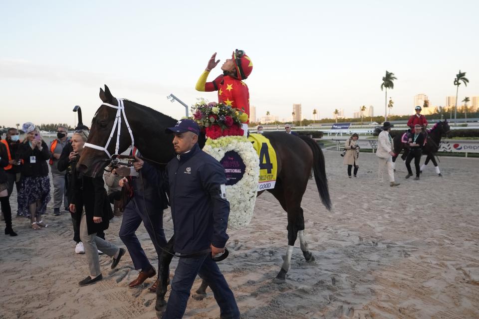 Jockey Irad Ortiz Jr., riding Life is Good, celebrates after winning the Pegasus World Cup dirt horse race, Saturday, Jan. 29, 2022, at Gulfstream Park in Hallandale Beach, Fla. (AP Photo/Wilfredo Lee)