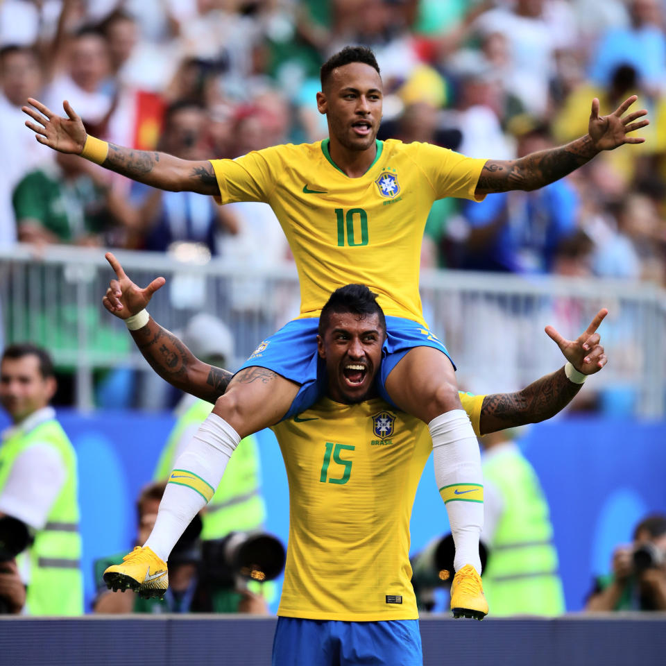  Walking tall: Neymar celebrates with Paulinho after putting Brazil 1-0 up early in the second half. (Photo by Chris Brunskill/Fantasista/Getty Images)