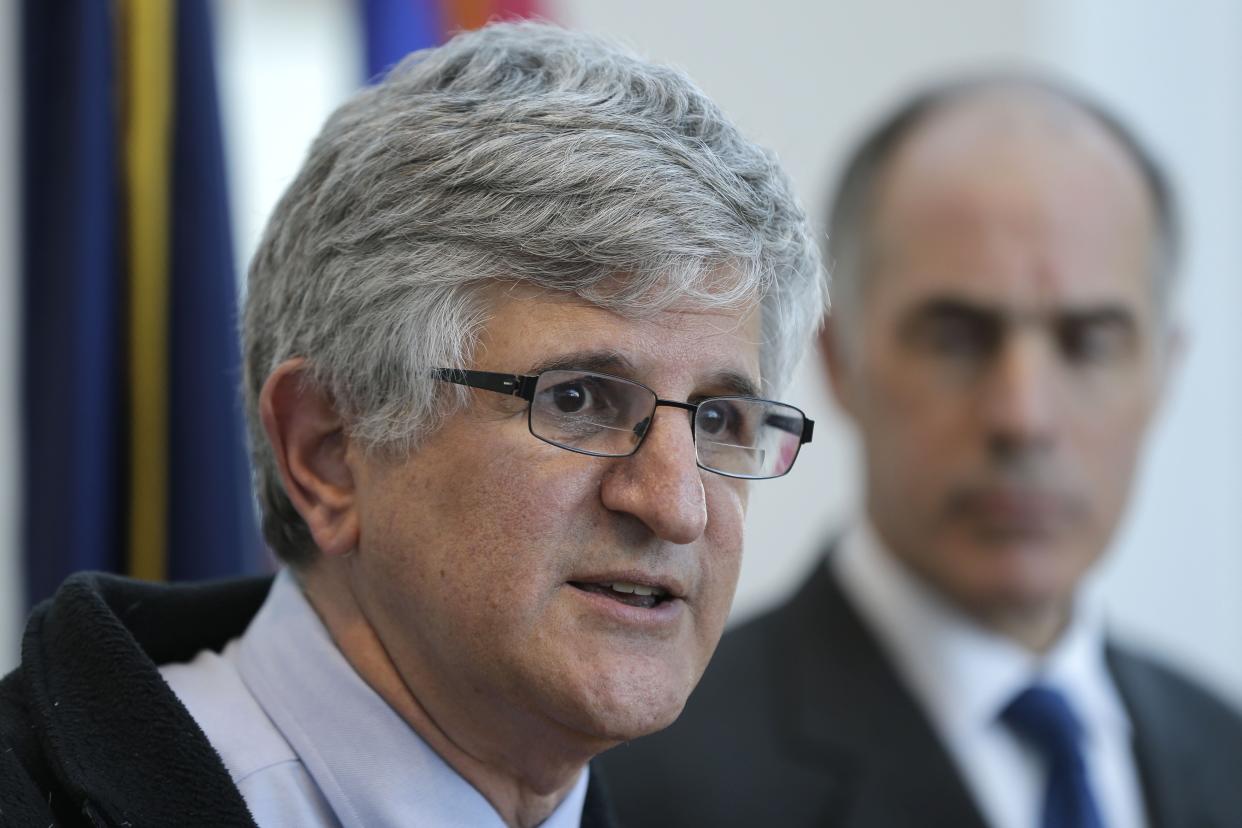 U.S. Sen. Bob Casey, right, looks on as Dr. Paul Offit, the Director of the Vaccine Education Center at at The Children's Hospital of Philadelphia, speaks during a news conference Friday, Feb. 13, 2015, in Philadelphia. (Matt Rourke/AP Photo)