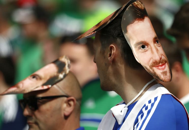 Northern Ireland fans wearing Will Grigg masks wait for the start of their Euro 2016 Group C match against Ukraine at the Parc Olympique Lyonnais stadium in Decines-Charpieu, near Lyon, on June 16, 2016