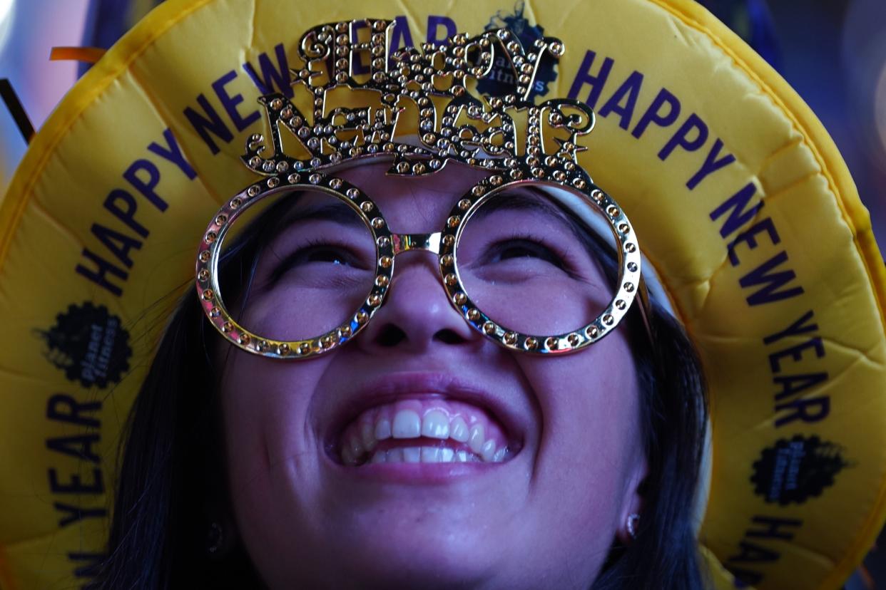 NEW YORK, NY - DECEMBER 31: A Reveler at Times Square waits for the midnight ball drop at the New Year's Eve celebration on December 31, 2022 in New York City. Revelers return to a full scale event after two years of scaled-back celebrations in response to the coronavirus pandemic. (Photo by David Dee Delgado/Getty Images)