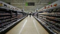 A shopper walks through the meat section at the Asda superstore in High Wycombe, Britain, February 8, 2017. REUTERS/Eddie Keogh