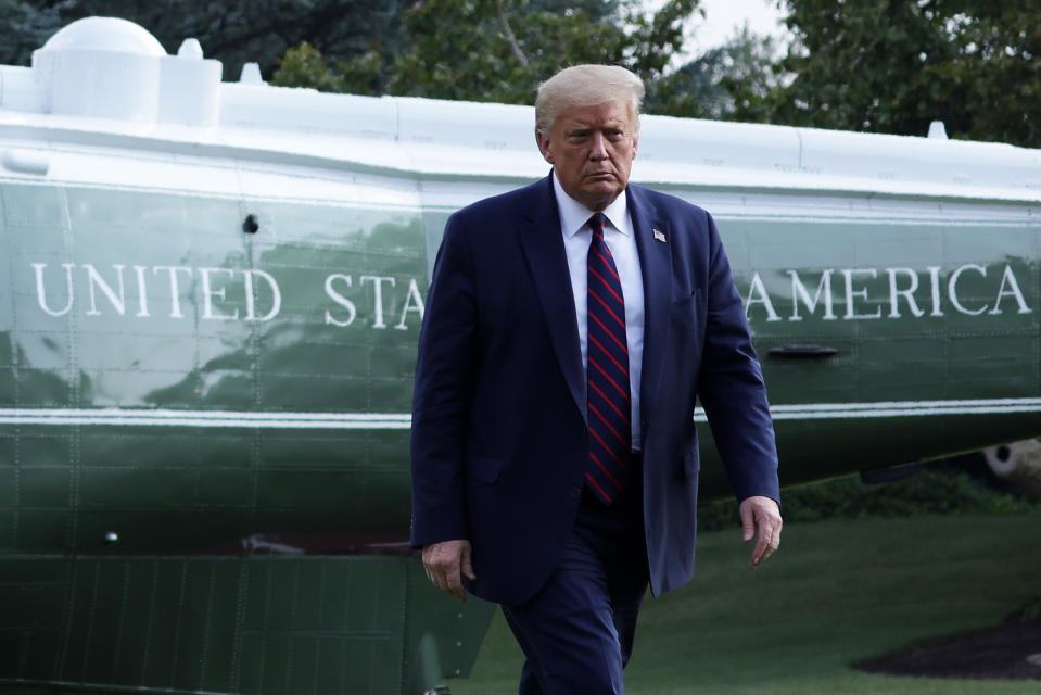 WASHINGTON, DC - JULY 27:  U.S. President Donald Trump walks on the South Lawn after he landing aboard Marine One at the White House July 27, 2020 in Washington, DC. Trump was returning from a visit to the FUJIFILM Diosynth Biotechnologies' Innovation Center in Morrisville, North Carolina, a facility that supports manufacturing of "key components of the COVID-19 vaccine candidate" developed by Novavax.  (Photo by Alex Wong/Getty Images)