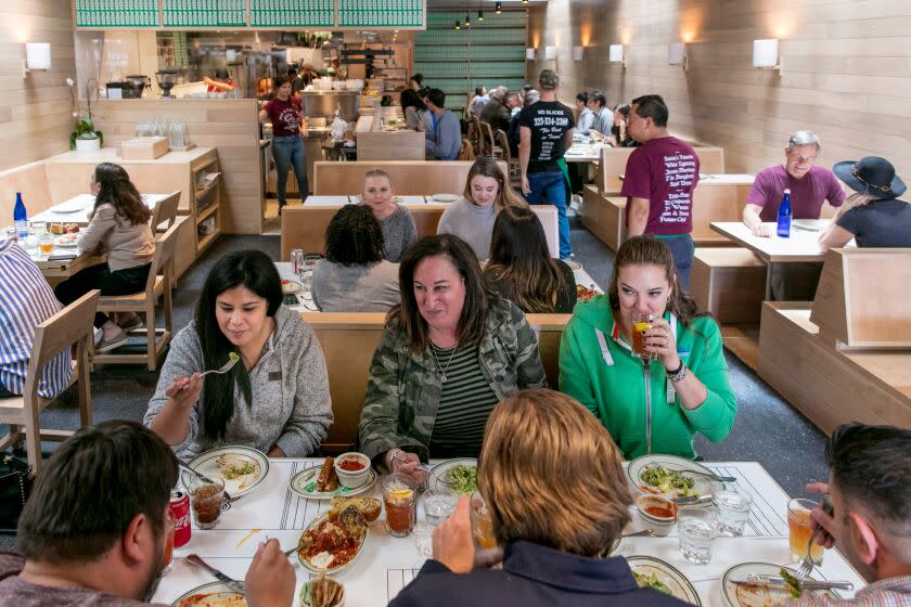 LOS ANGELES, CALIFORNIA - APR. 30, 2019: Regulars (L to R) Jessica Gonzales, Lisa Higgins, and Rachel Kielborn enjoy lunch with family and friends at Jon & Vinny's on Tuesday, Apr. 30, 2019, at the second installment of the Italian restaurant, in Brentwood. (Photo / Silvia Razgova) 3078377_la-fo-bill-addison-jon-and-vinnys-review