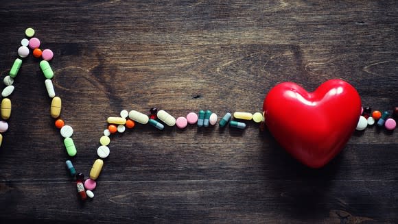 Electrocardiogram made of colorful pills.