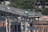 <p>This view taken on Aug. 15, 2018, shows abandoned vehicles on the Morandi motorway bridge the day after a section collapsed in the north-western Italian city of Genoa. At least 38 people were killed on Aug. 14, when the giant motorway bridge collapsed in Genoa in northwestern Italy. The collapse, which saw a vast stretch of the A10 freeway tumble on to railway lines in the northern port city, was the deadliest bridge failure in Italy. (Photo from Valery Hache/AFP/Getty Images) </p>