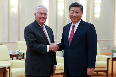 U.S. Secretary of State Rex Tillerson (L) shakes hands with Chinese President Xi Jinping (R) before their meeting at the Great Hall of the People on September 30, 2017 in Beijing, China. REUTERS/Lintao Zhang/Pool