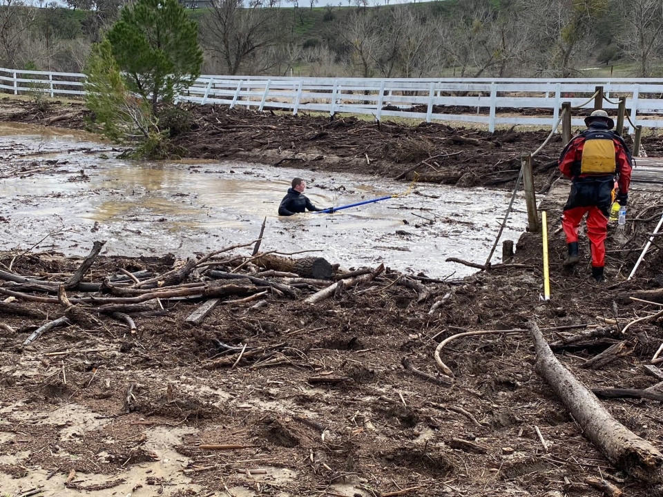 In this photo provided by San Luis Obispo County Sheriff's Office, rescuers resume their search on Wednesday, Jan. 11, 2023, for 5-year-old Kyle Doan, who was swept away Monday, Jan. 9, by floodwaters near San Miguel, Calif. (San Luis Obispo County Sheriff's Office via AP)