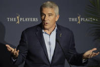 PGA Tour Commissioner Jay Monahan reacts to a question during a news conference at The Players Championship golf tournament, in Ponte Vedra Beach, Fla., early Friday, March 13, 2020. The PGA Tour first said there would be no fans. Now there will be no players. In a late Thursday night decision, the PGA Tour canceled the rest of The Players Championship and said it would not play the next three weeks. (AP Photo/Chris O'Meara)