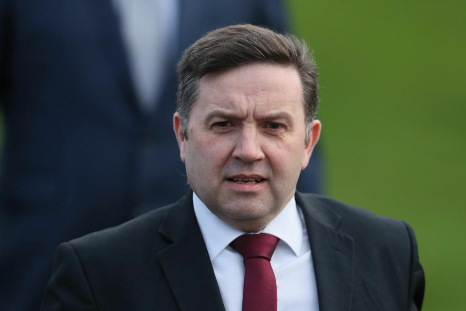 Ulster Unionist Party (UUP) leader Robin Swann arrives at Stormont in Belfast, Northern Ireland, ahead of talks with British Prime Minister Theresa May on the second day of her visit to Belfast, Wednesday Feb. 6, 2019. Following talks in Northern Ireland Wednesday, May plans to meet with European leaders in Brussels on Thursday seeking changes to the so called Irish backstop, before Britain leaves the EU on upcoming March 29. (Brian Lawless/PA via AP)