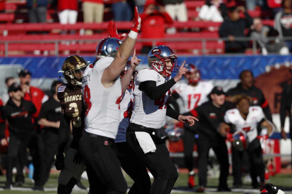 Western Kentucky place kicker Cory Munson, right, celebrates after kicking the game winning field goal in the final seconds of the NCAA First Responder Bowl college football game against Western Michigan in Dallas, Monday, Dec. 30, 2019. Western Kentucky won the game 23-20. (AP Photo/Roger Steinman)