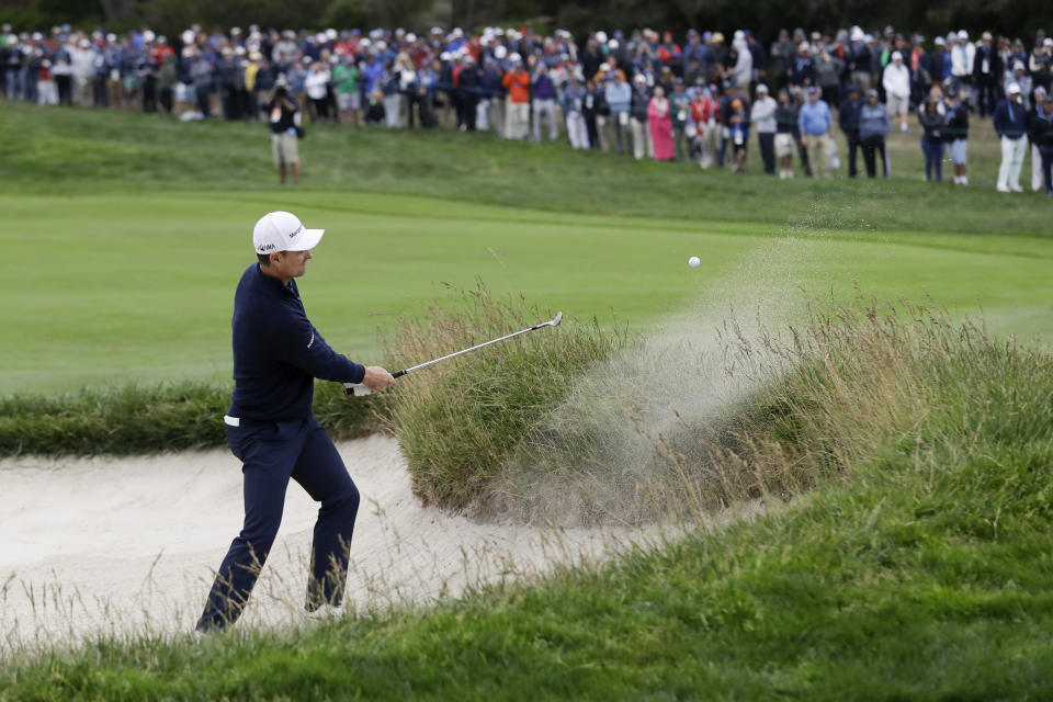 Justin Rose, of England, hits out of the bunker on the 15th hole during the final round of the U.S. Open Championship golf tournament Sunday, June 16, 2019, in Pebble Beach, Calif. (AP Photo/Marcio Jose Sanchez)