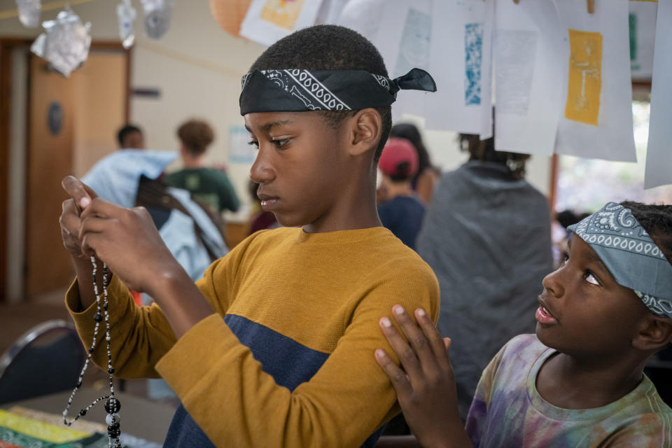 Wearing bandanas for "Pirate Day," Major Smith, 10, right, looks to Sasha Wernick, 11, of Brooklyn, as they dress up celebrating the Jewish people of the Caribbean during Camp Be'chol Lashon, a sleepaway camp for Jewish children of color, Friday, July 28, 2023, in Petaluma, Calif., at Walker Creek Ranch. (AP Photo/Jacquelyn Martin)