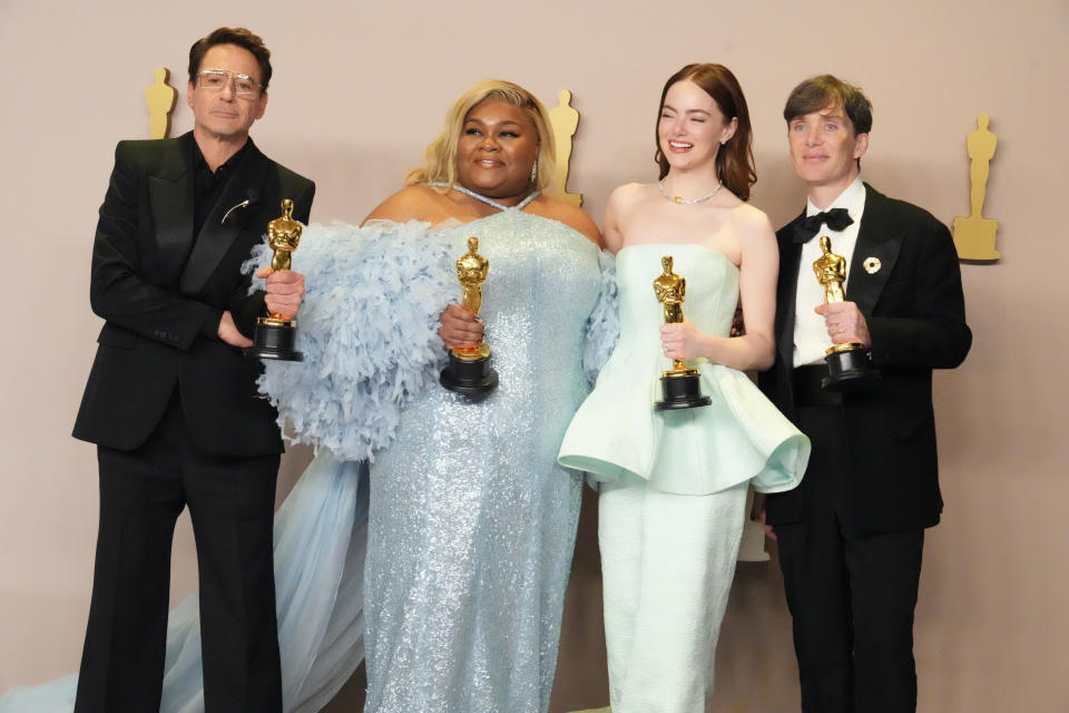 HOLLYWOOD, CALIFORNIA - MARCH 10: (L-R) Robert Downey Jr., winner of the Best Actor in a Supporting Role award for “Oppenheimer”, Da'Vine Joy Randolph, winner of the Best Supporting Actress award for “The Holdovers”, Emma Stone, winner of the Best Actress in a Leading Role award for “Poor Things”, and Cillian Murphy, winner of the Best Actor in a Leading Role award for “Oppenheimer”, pose in the press room during the 96th Annual Academy Awards at Ovation Hollywood on March 10, 2024 in Hollywood, California. (Photo by Jeff Kravitz/FilmMagic)