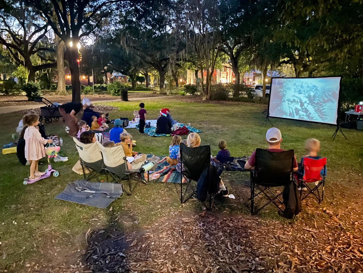 Local Savannahians enjoy an outdoor movie, one of many events put on by the Midtown Savannah Parents Group.