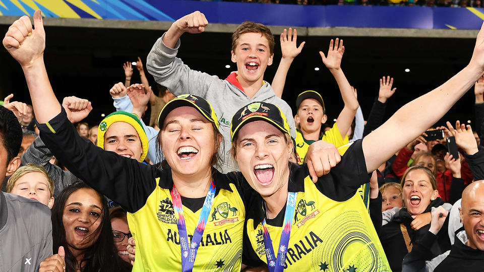 Molly Strano and Sophie Molineux are pictured celebrating their victory in the T20 World Cup.