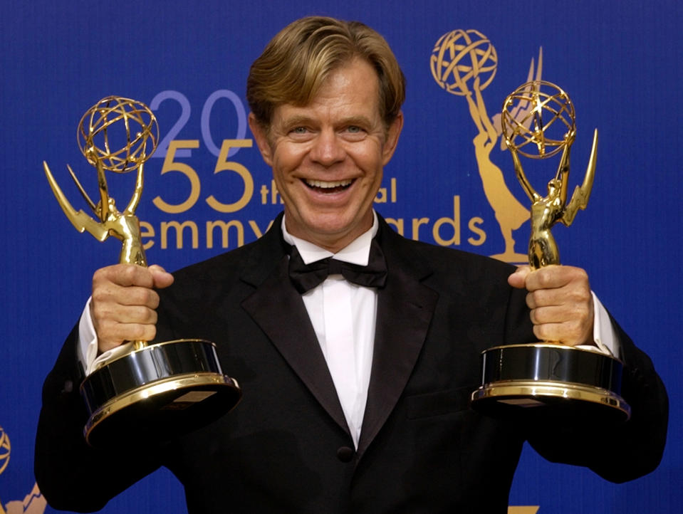 William H. Macy holds his two awards for outstanding lead actor in a movie and outstanding writing in a movie for his work in "Door to Door" at the 55th annual Primetime Emmy Awards Sunday, Sept. 21, 2003, in Los Angeles. (AP Photos/Reed Saxon)