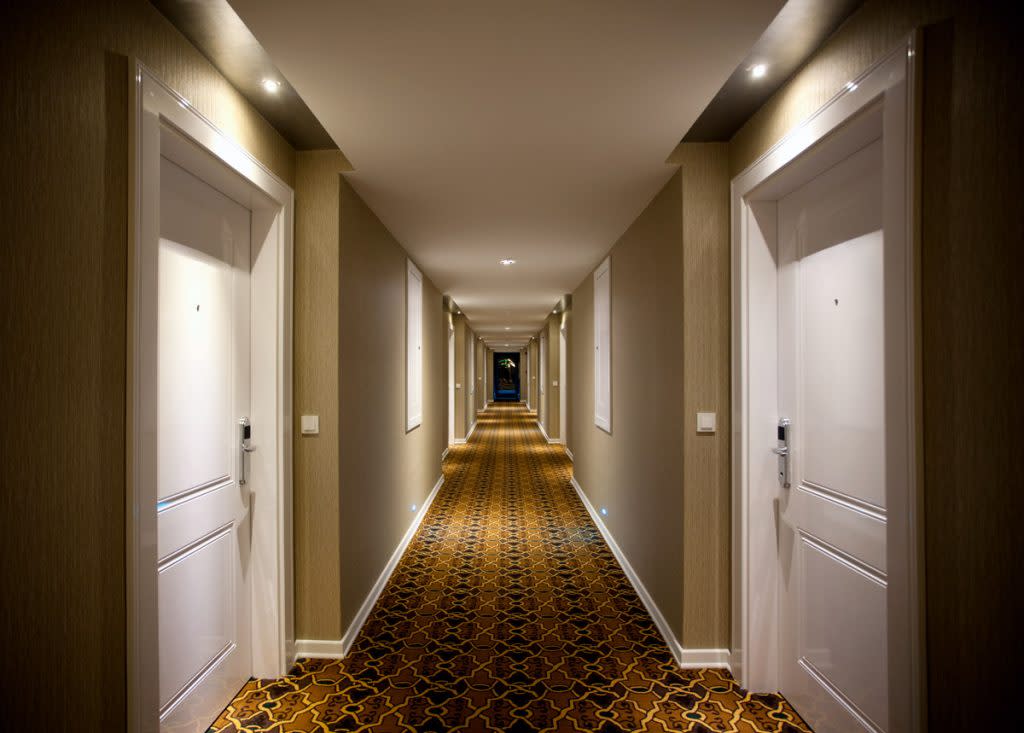 An empty hotel corridor. 