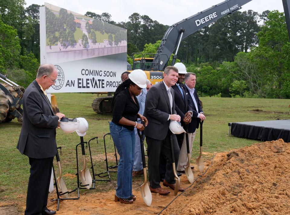 The City of Tuscaloosa broke ground at the Oliver Lock and Dam Park in West Tuscaloosa for a Riverwalk extension Monday, May 8, 2023. Mayor Walt Maddox and city council members don helmets and pick up shovels for the groundbreaking ceremony. 