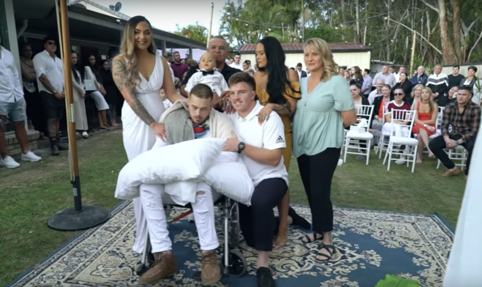 The Gold Coast couple pose with guests at the wedding a day before his death. 