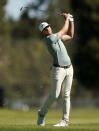 Sam Burns hits his second shot on the third hole during the final round of the Genesis Invitational golf tournament at Riviera Country Club, Sunday, Feb. 21, 2021, in the Pacific Palisades area of Los Angeles. (AP Photo/Ryan Kang)