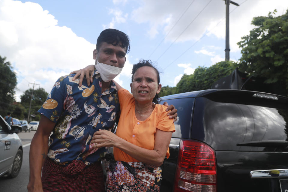 A detainee is welcomed by his mother after being released from Insein Prison Tuesday, Oct. 19, 2021, in Yangon, Myanmar. Myanmar's government on Monday announced an amnesty for thousands of prisoners arrested for taking part in anti-government activities following February's seizure of power by the military. (AP Photo)