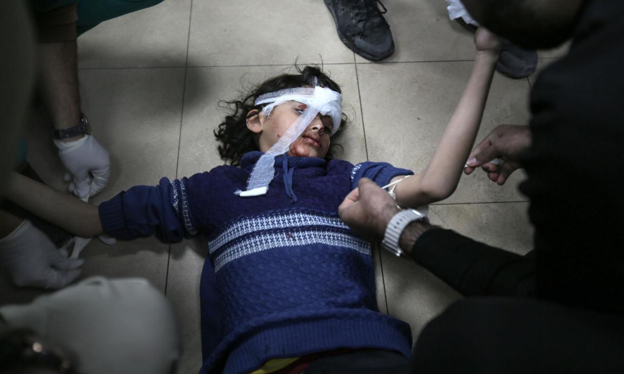<span>A young girl lies on the floor at the hospital after an Israeli airstrike on a residential building in al-Mughraqa, central Gaza Strip, on Monday.</span><span>Photograph: Majdi Fathi/NurPhoto/Rex/Shutterstock</span>