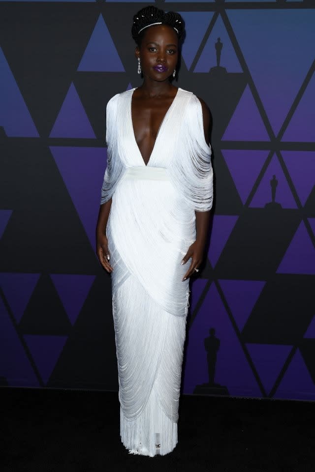 The ever chic and stylish Lupita Nyong'o stepped out in a white fringe-effect gown by Tom Ford. Hollywood, November 18, 2018
