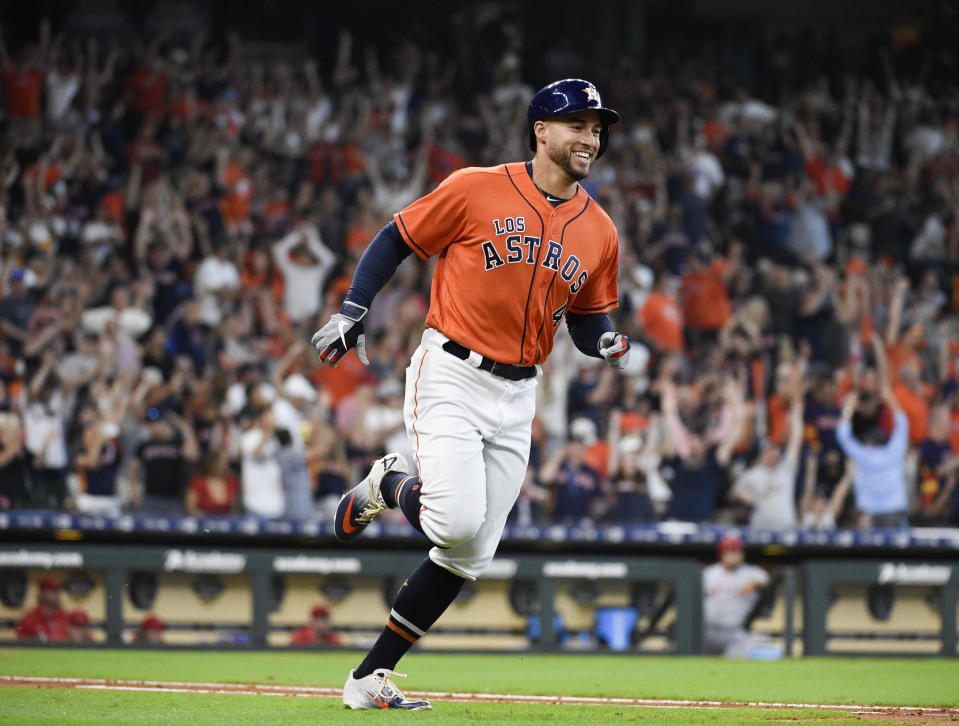 Houston Astros' George Springer rounds the bases after hitting a solo home run off Los Angeles Angels relief pitcher Jose Suarez during the fourth inning of a baseball game Sunday, Sept. 22, 2019, in Houston. it was Springer's third home run of the game. (AP Photo/Eric Christian Smith)