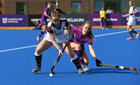 Surbiton's Alice Sharp and Loughborough's Maddie Pearce in action