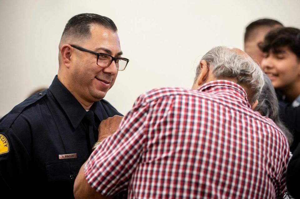 Gustine Police Department Reserve Officer Arthur Rincon has his badge pinned on by his father Albert, during a swearing in ceremony for four new Gustine Police Department Reserve Officers in Gustine, Calif., on Tuesday, June 20, 2023. Andrew Kuhn/akuhn@mercedsun-star.com