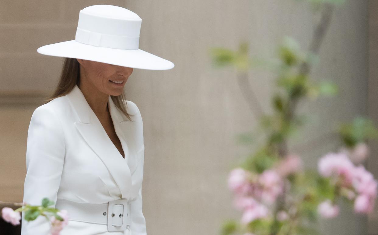 Then-first lady Melania Trump tours the National Gallery of Art in Washington, D.C, in a hat designed especially for her by her personal stylist, the Franco-American Herve Pierre.