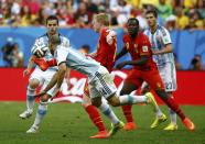 Argentina's Fernando Gago (L) and Javier Mascherano fight for the ball with Belgium's Kevin De Bruyne and Romelu Lukaku (R) during their 2014 World Cup quarter-finals at the Brasilia national stadium in Brasilia July 5, 2014. REUTERS/Damir Sagolj