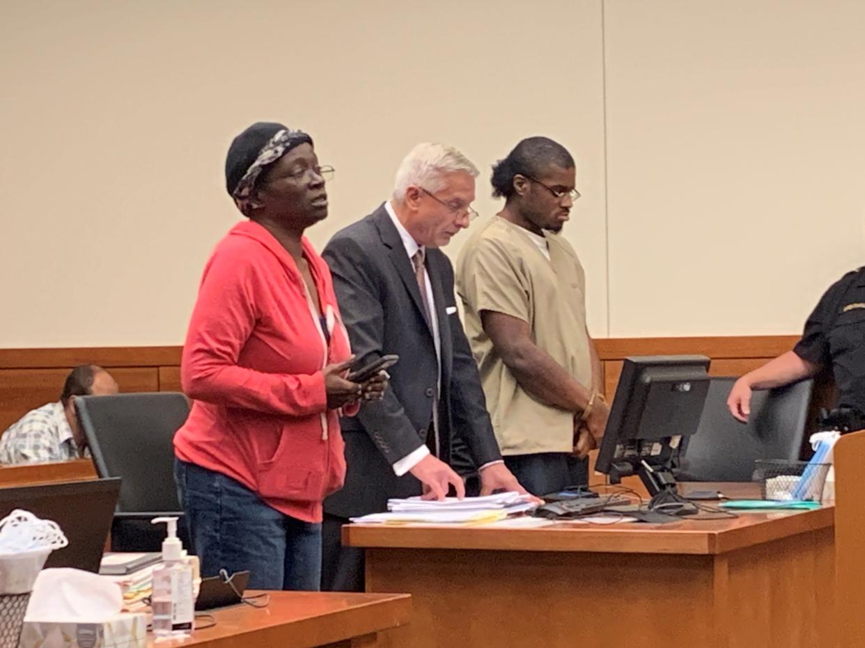 Christopher W. Martin, 32, of Columbus' South Side, right, stands with his defense attorney, Robert Krapenc, as his mother, Christie Brooks, left, asks for leniency for her son during his sentencing hearing Tuesday in Franklin County Common Pleas Court.  Christopher Martin was convicted of aggravated murder and kidnapping for fatally stabbing his girlfriend, 30-year-old Erika D. Daniels, a total 26 times during an argument on May 9, 2018.