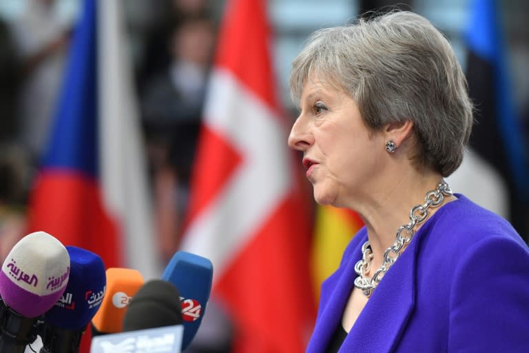 Prime Minister Theresa May says Britain will consider extending the transition period after Brexit for a few months